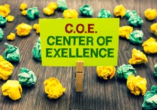 Word writing text C.O.E Center Of Excellence. Business concept for being alpha leader in your position Achieve Clothespin holding royalty free stock images Word writing text C.O.E Center Of Excellence. Business concept for being alpha leader in your position Achieve Clothespin holding royalty free stock images