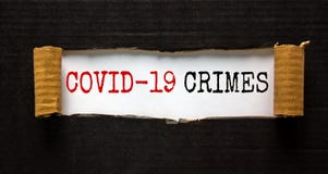 The words `covid-19 crimes` appearing behind torn black paper. Beautiful background. Business concept