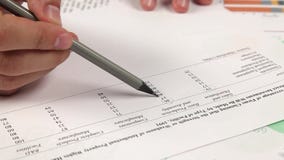 Work with financial report on table stock video footage Work with financial report on table stock video footage