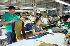 Worker in a chinese garment factory Royalty Free Stock Images Worker in a chinese garment factory Royalty Free Stock Images