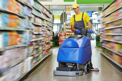 Worker Cleaning Store Floor With Machine Royalty Free Stock Images Worker Cleaning Store Floor With Machine Royalty Free Stock Images