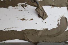 Worker hand applying glue on foam sheet royalty free stock photo Worker hand applying glue on foam sheet royalty free stock photo