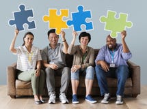 Worker holding a jigsaw puzzle Royalty Free Stock Images Worker holding a jigsaw puzzle Royalty Free Stock Images