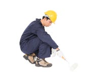 Worker In A Uniform Using A Paint Roller Is Painting Invisible F Stock Photo