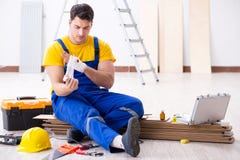 The worker with injured hand at construction site Royalty Free Stock Image The worker with injured hand at construction site Royalty Free Stock Image