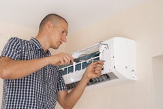 Installation and repair of air conditioner stock image Installation and repair of air conditioner stock image