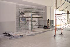 Worker on scaffolding installing gypsum wall. royalty free stock photography Worker on scaffolding installing gypsum wall. royalty free stock photography