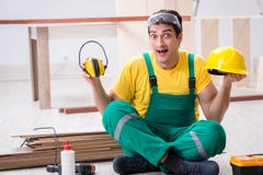 Worker showing the importnace of wearing noise cancelling headph royalty free stock photos Worker showing the importnace of wearing noise cancelling headph royalty free stock photos