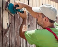 Worker using vibrating sander machine royalty free stock photos Worker using vibrating sander machine royalty free stock photos
