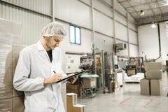 Worker In warehouse for food packaging Royalty Free Stock Images Worker In warehouse for food packaging Royalty Free Stock Images