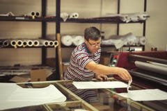 Worker working in fabric industry stock photo Worker working in fabric industry stock photo
