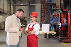 Workers & boss in factory royalty free stock photos Workers & boss in factory royalty free stock photos