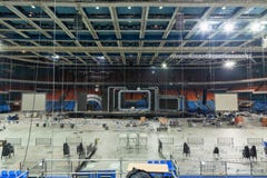 Workers dismantle stage and stage equipment