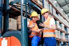 Workers in logistics warehouse royalty free stock photo Workers in logistics warehouse royalty free stock photo