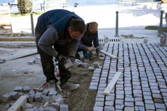 Workers setting up pavements stock photography Workers setting up pavements stock photography