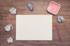 Working desk with paper balls and clock. Looking for an idea with limited time concept royalty free stock photo Working desk with paper balls and clock. Looking for an idea with limited time concept royalty free stock photo