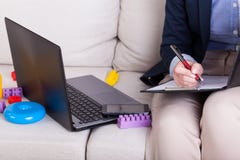 Working mother among toys royalty free stock image Working mother among toys royalty free stock image