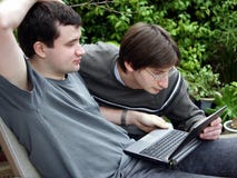 Working together. 2 young men with laptop Working together. 2 young men with laptop