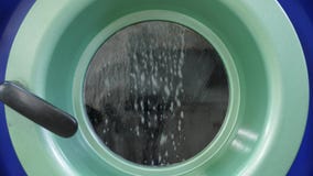 Working washing machine in dry cleaning salon