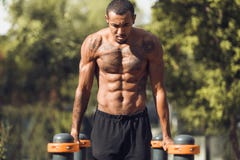 Man doing push ups on parallel bars royalty free stock photo Man doing push ups on parallel bars royalty free stock photo