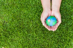 World Earth Day concept. Woman hand holding handmade globe
