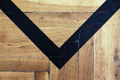 Worn out wooden floor of sports hall with colorful marking lines. Stock Images Worn out wooden floor of sports hall with colorful marking lines. Stock Images