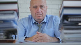 Worried Businessman in Accounting Archive Looking Troubled and Disappointed royalty free stock photos Worried Businessman in Accounting Archive Looking Troubled and Disappointed royalty free stock photos