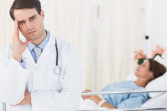 Worried doctor with patient in hospital royalty free stock photography Worried doctor with patient in hospital royalty free stock photography