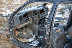 Wreck of a devastated car on a meadow. Disassembled car skeleton royalty free stock image Wreck of a devastated car on a meadow. Disassembled car skeleton royalty free stock image