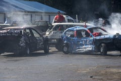 Wrecked cars in action during the demolition derby Stock Photo Wrecked cars in action during the demolition derby Stock Photo