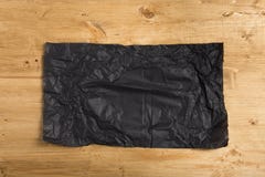 Wrinkled paper on wooden background royalty free stock photos Wrinkled paper on wooden background royalty free stock photos
