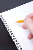 Writing in a blank spiral notebook Writing in a blank spiral notebook