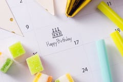 Writing cake on calendar happy birthday