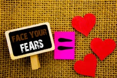 Writing text showing Face Your Fears. Concept meaning Challenge Fear Fourage Confidence Brave Bravery written on blackboard equat royalty free stock images Writing text showing Face Your Fears. Concept meaning Challenge Fear Fourage Confidence Brave Bravery written on blackboard equat royalty free stock images