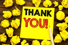 Writing text showing Thank You. Business concept for Thanks Message Written on sticky note paper, wooden background with folded ye royalty free stock photography Writing text showing Thank You. Business concept for Thanks Message Written on sticky note paper, wooden background with folded ye royalty free stock photography
