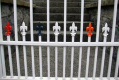 Wrought iron fence with decorative fleur de lis capping vertical bars. stock photography Wrought iron fence with decorative fleur de lis capping vertical bars. stock photography
