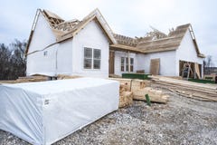 2x4`s and lumber stacked in front of new home construction site stock photos 2x4`s and lumber stacked in front of new home construction site stock photos