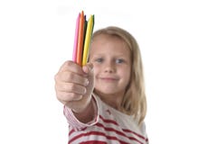 6 or 7 years old beautiful little girl holding multicolor crayons set in art school children education concept Royalty Free Stock Photos 6 or 7 years old beautiful little girl holding multicolor crayons set in art school children education concept Royalty Free Stock Photos