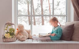 3 years old girl learning to read stock photo 3 years old girl learning to read stock photo