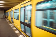 Yellow blurred subway train in Berlin royalty free stock photography Yellow blurred subway train in Berlin royalty free stock photography