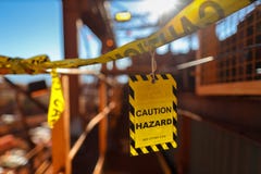Yellow caution sign/ symbols tag applying on the entry construction workplace to ensure safety warning precaution in place