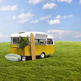 Yellow food truck caravan on grass field