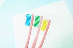 Yellow, green and turquoise bamboo toothbrushes. Eco-friendly concept. Minimal concept. Copy space royalty free stock photo Yellow, green and turquoise bamboo toothbrushes. Eco-friendly concept. Minimal concept. Copy space royalty free stock photo