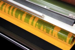 Yellow Ink In A Printing Press Royalty Free Stock Photos