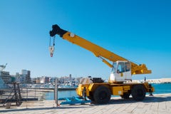 Yellow loading crane in port stock photo Yellow loading crane in port stock photo