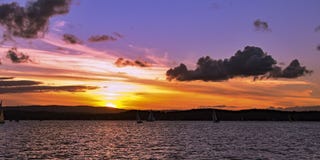 Yellow orange colored stratus cumulus cloud, sunset seascape. royalty free stock photography Yellow orange colored stratus cumulus cloud, sunset seascape. royalty free stock photography
