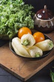 Yellow pepper Fresh vegetables on a wooden board. Vegan food stock photos Yellow pepper Fresh vegetables on a wooden board. Vegan food stock photos