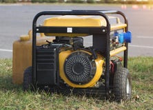 Yellow petrol portable generator on wheels, close-up, emergency