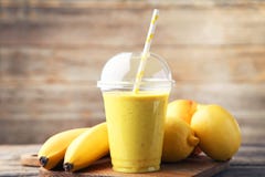 Download Yellow Smoothie In Plastic Cup Stock Image Image Of Diet Beverage 106158975 Yellowimages Mockups