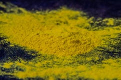 Yellow spice turmeric powder on a wooden board royalty free stock photo Yellow spice turmeric powder on a wooden board royalty free stock photo